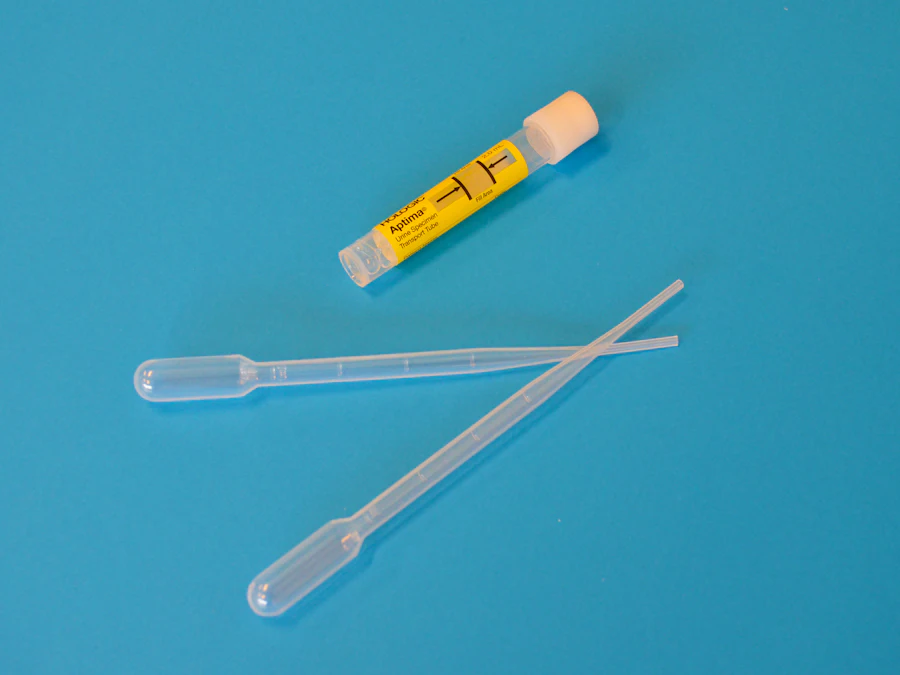 Laboratory sample collection swabs on a blue background